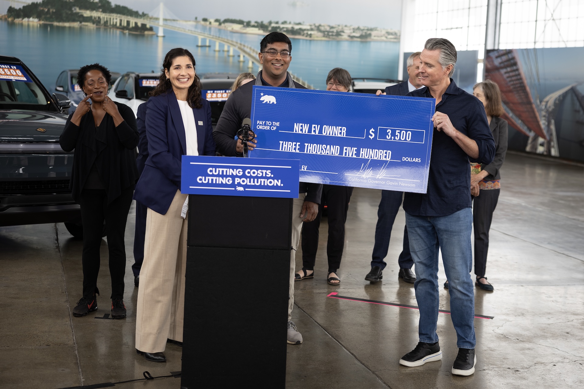 Governor Newsom and CARB Chair Lauren Sanchez present MyFirstEV recipient with instant purchase rebate
