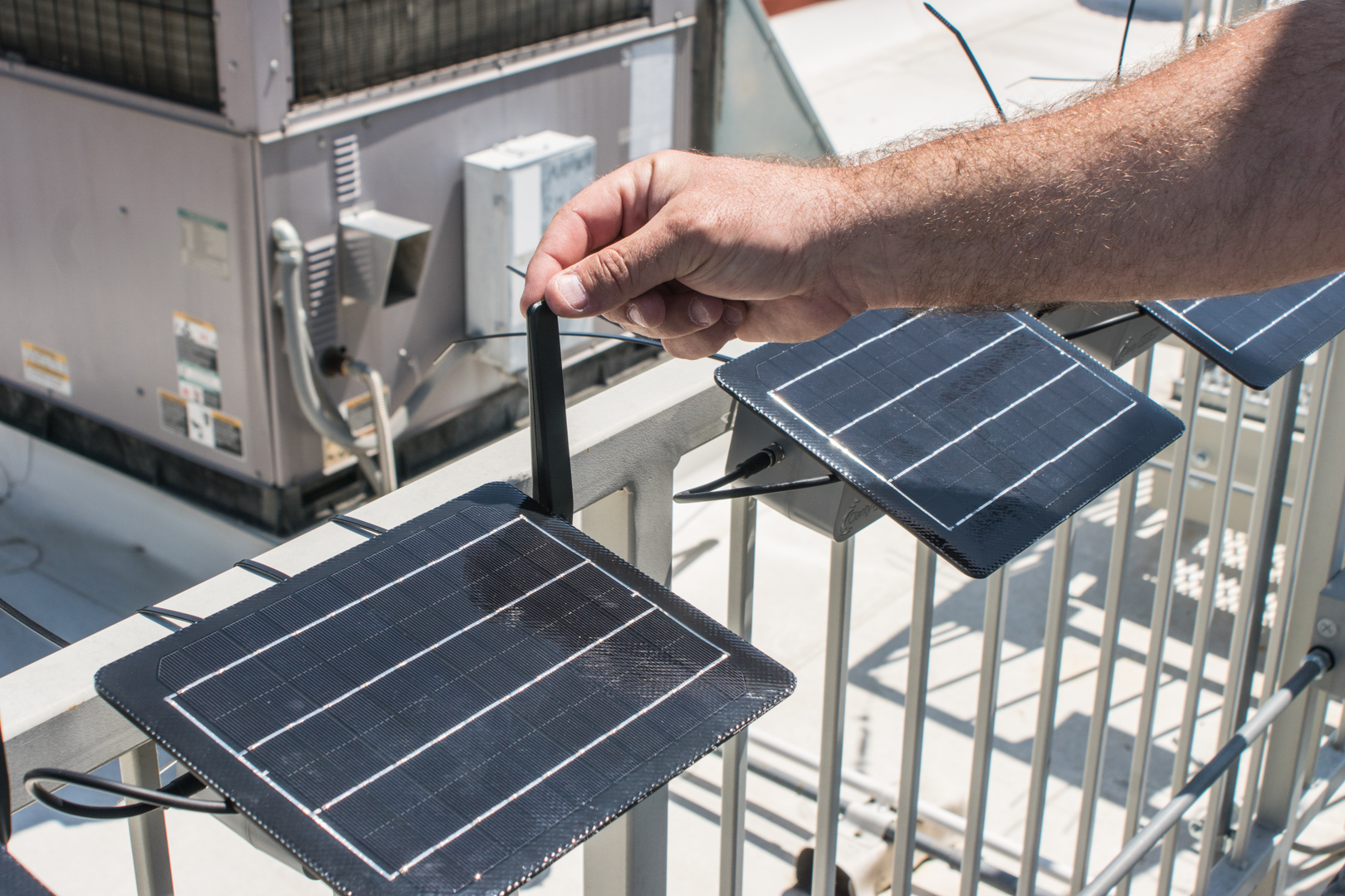 A CARB air specialist calibrates a community air monitor in the field.