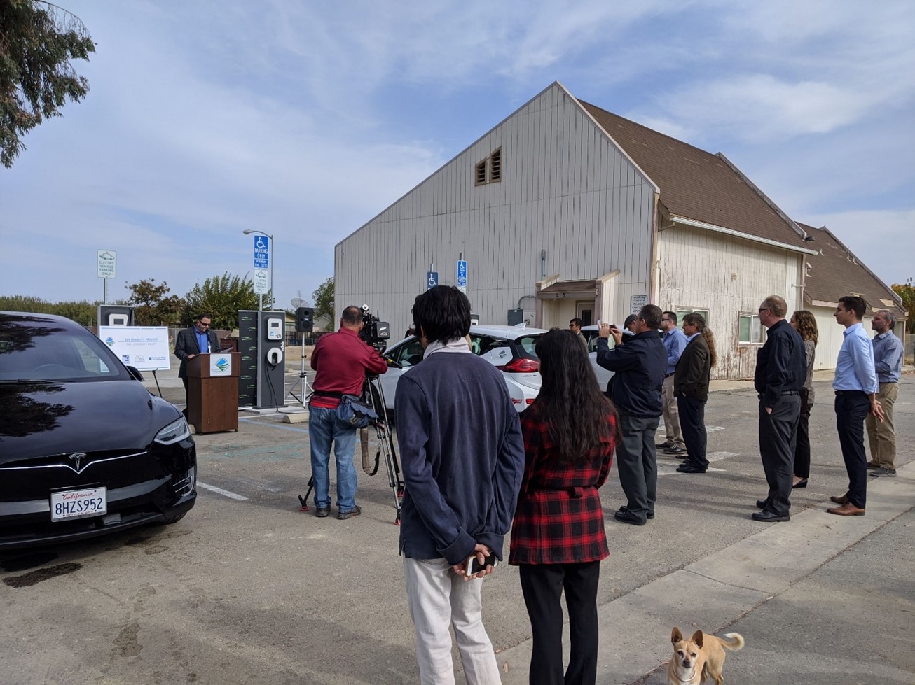 Project press event with community members touring EVs