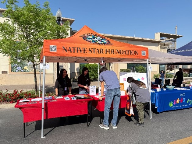 Students in front of Native Star Foundation booth.