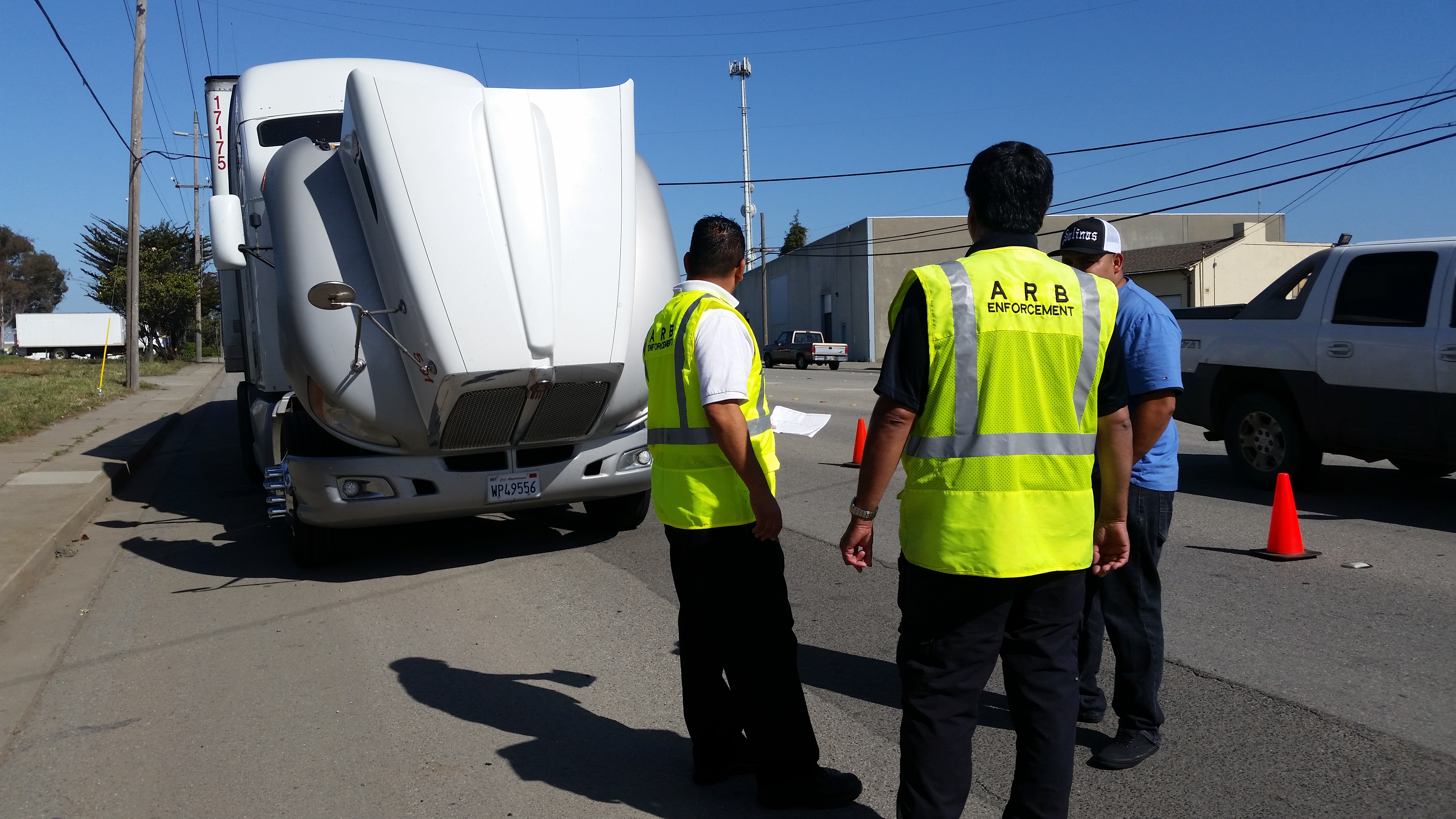 CARB staff members conducting a roadside inspection of a commercial diesel truck