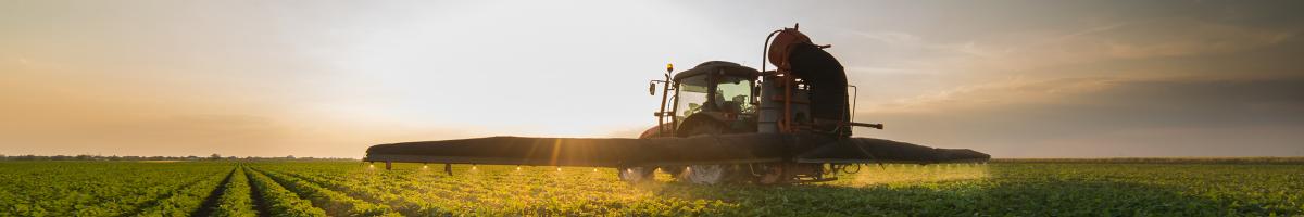 tractor spraying field