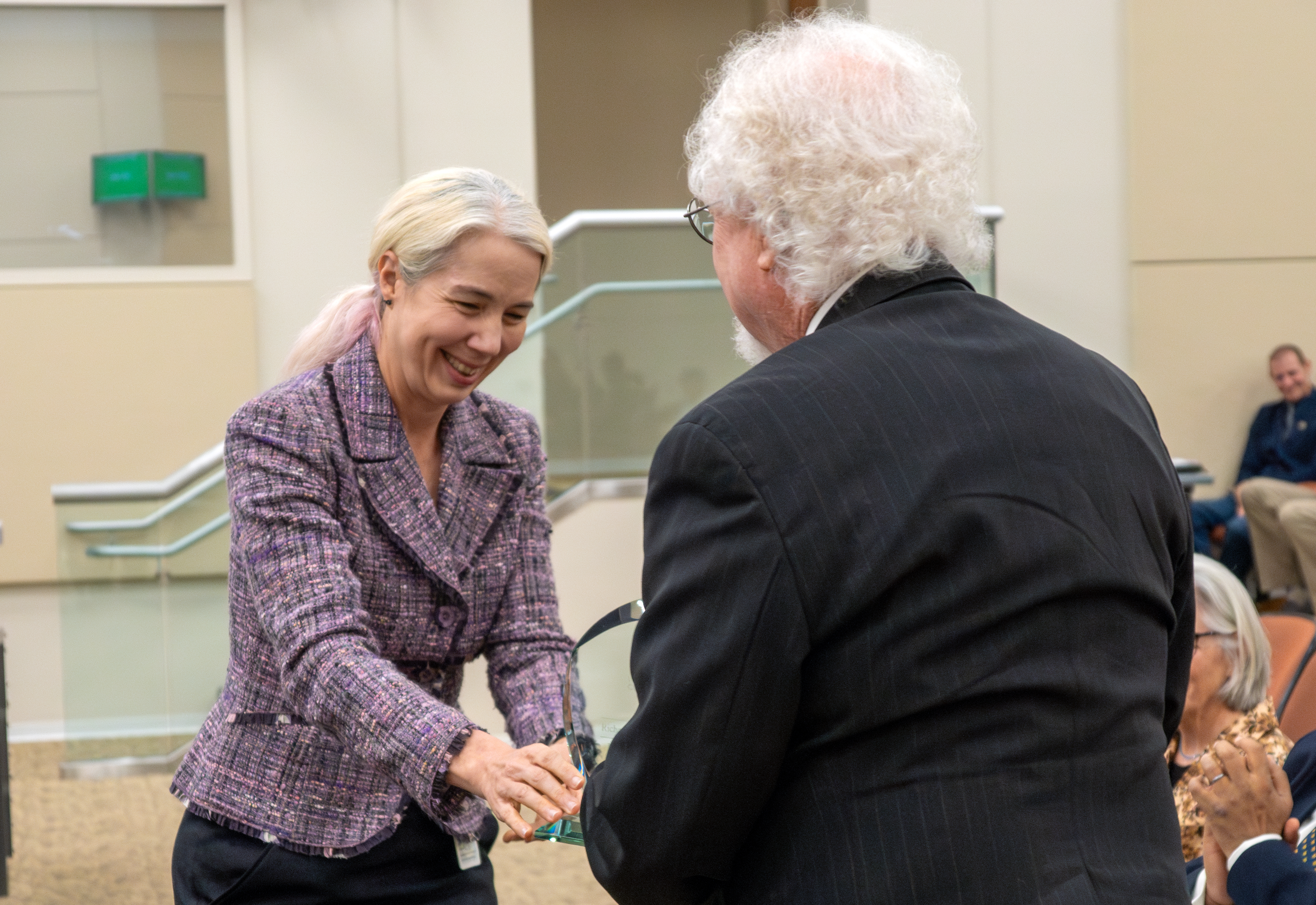 Research Division Chief Elizabeth Scheehle presents a 2023 Haagen-Smit Clean Air Award to Richard Flagan..