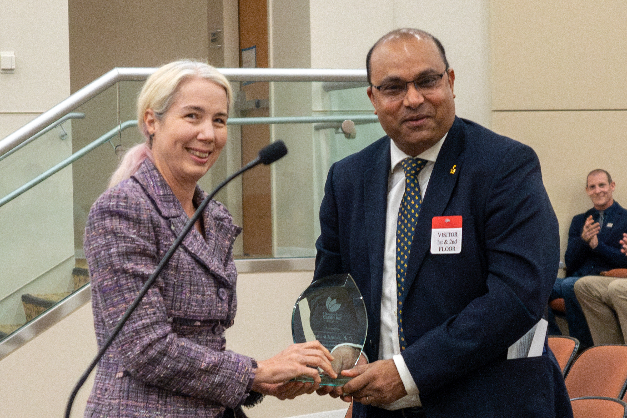 Research Division Chief Elizabeth Scheehle presents a 2023 Haagen-Smit Clean Air Award to Prashant Kumar..
