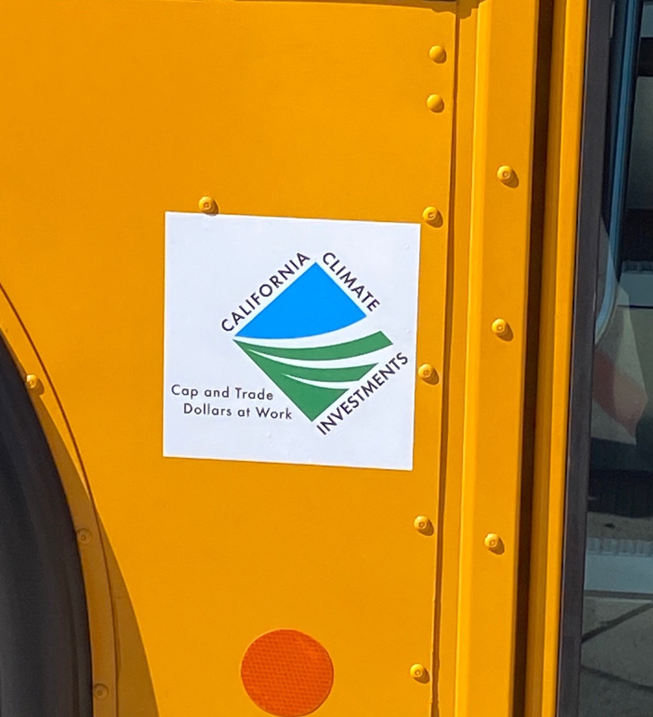Closeup of CCI logo on electric bus