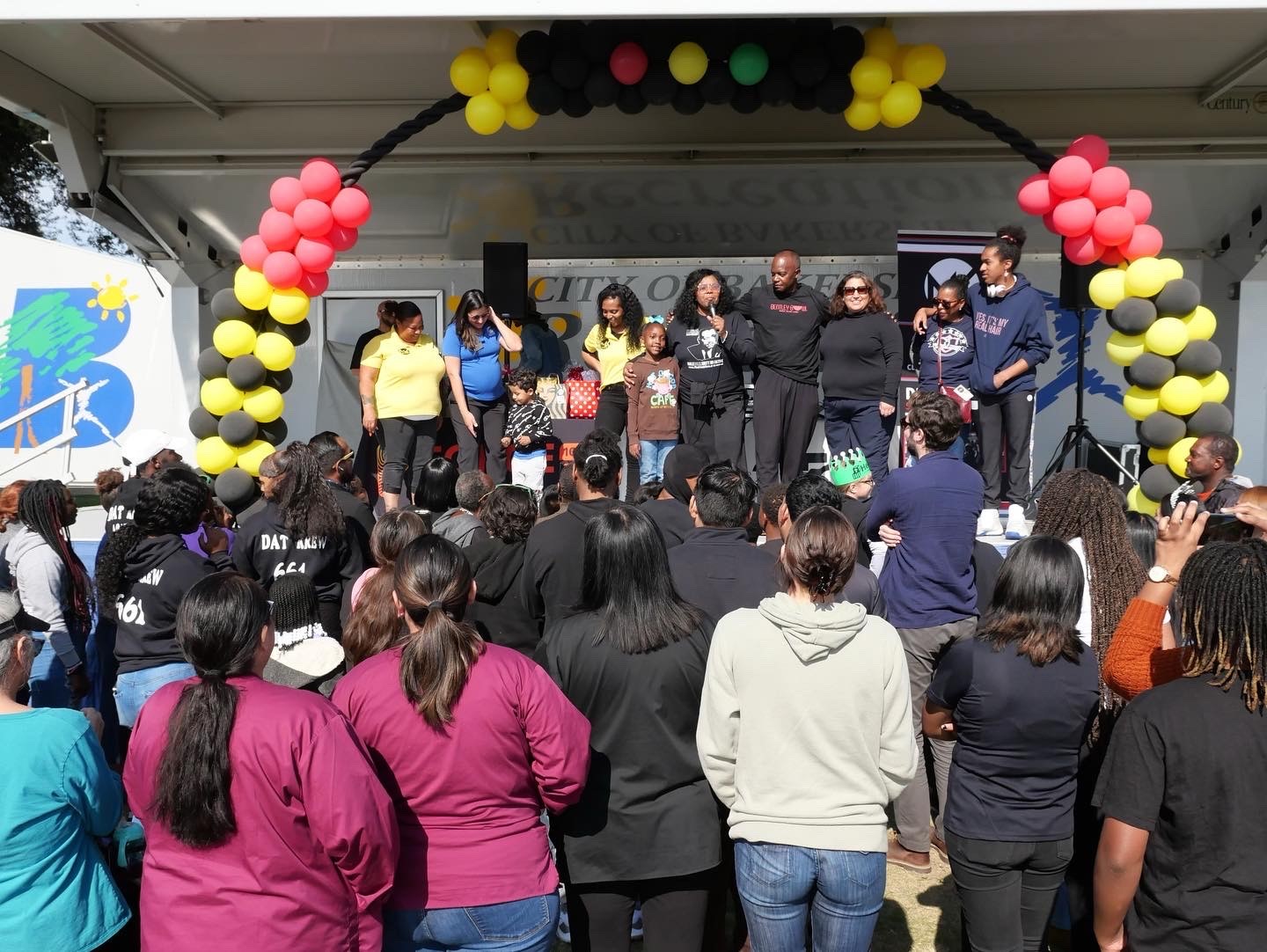 Transportation Day event with residents and speakers on stage discussing project 