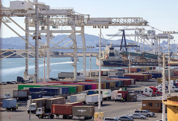 Cargo handling equipment with containerized goods at Howard Terminal, Port of Oakland
