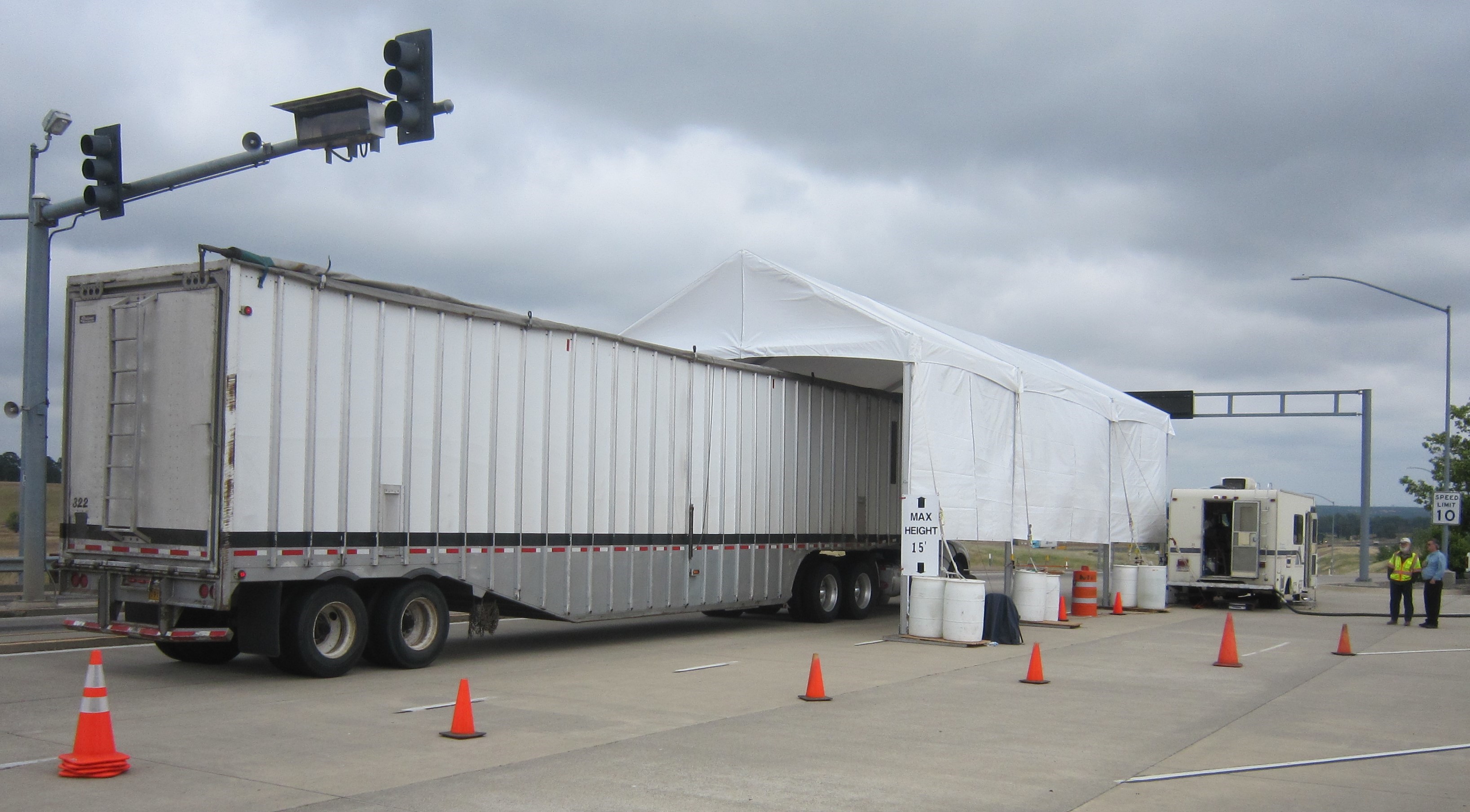 Heavy duty truck entering sampling tent