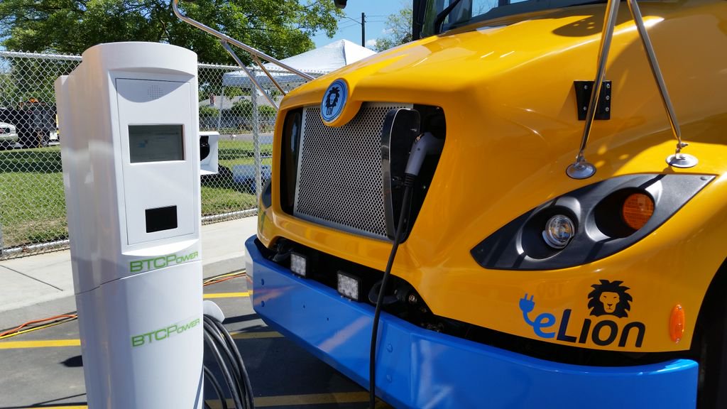 Electric school bus and charger