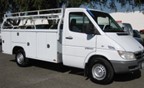 Image of cutaway van upfitted for utility. This is considered a work truck.