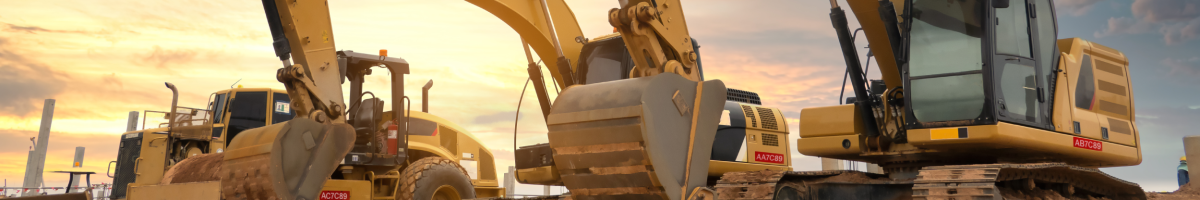 Image of heavy-duty diesel fueled off-road construction equipment parked at a construction site.