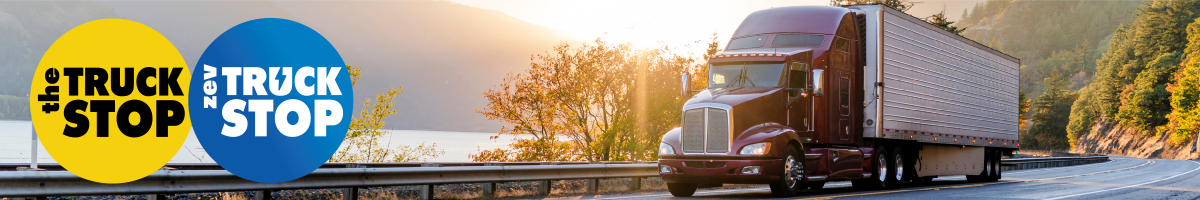 Image of a red diesel truck on a mountain road with water in the background with the TruckStop and ZEV TruckStop logos