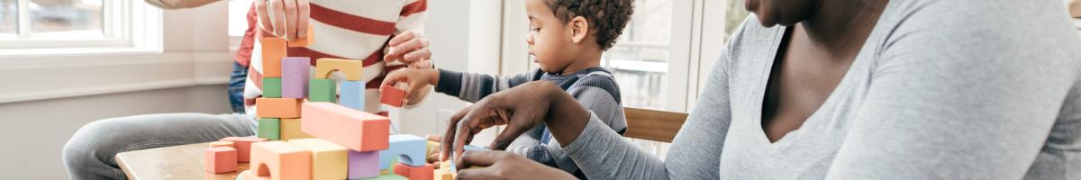 Parents playing with young child