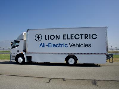 Photo of white all-electric semi-truck with the brand name, Lion Electric, on the side.