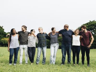 Group of people hugging each other in the park